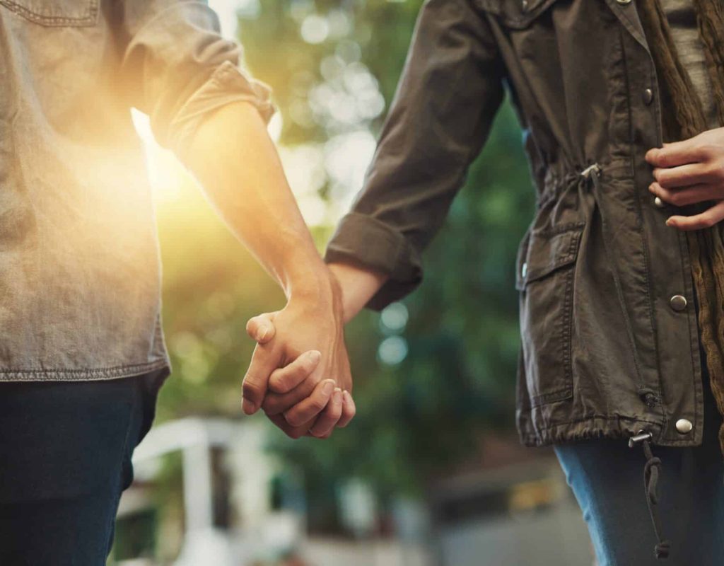 love,,holding,hands,and,couple,in,city,for,travel,,journey